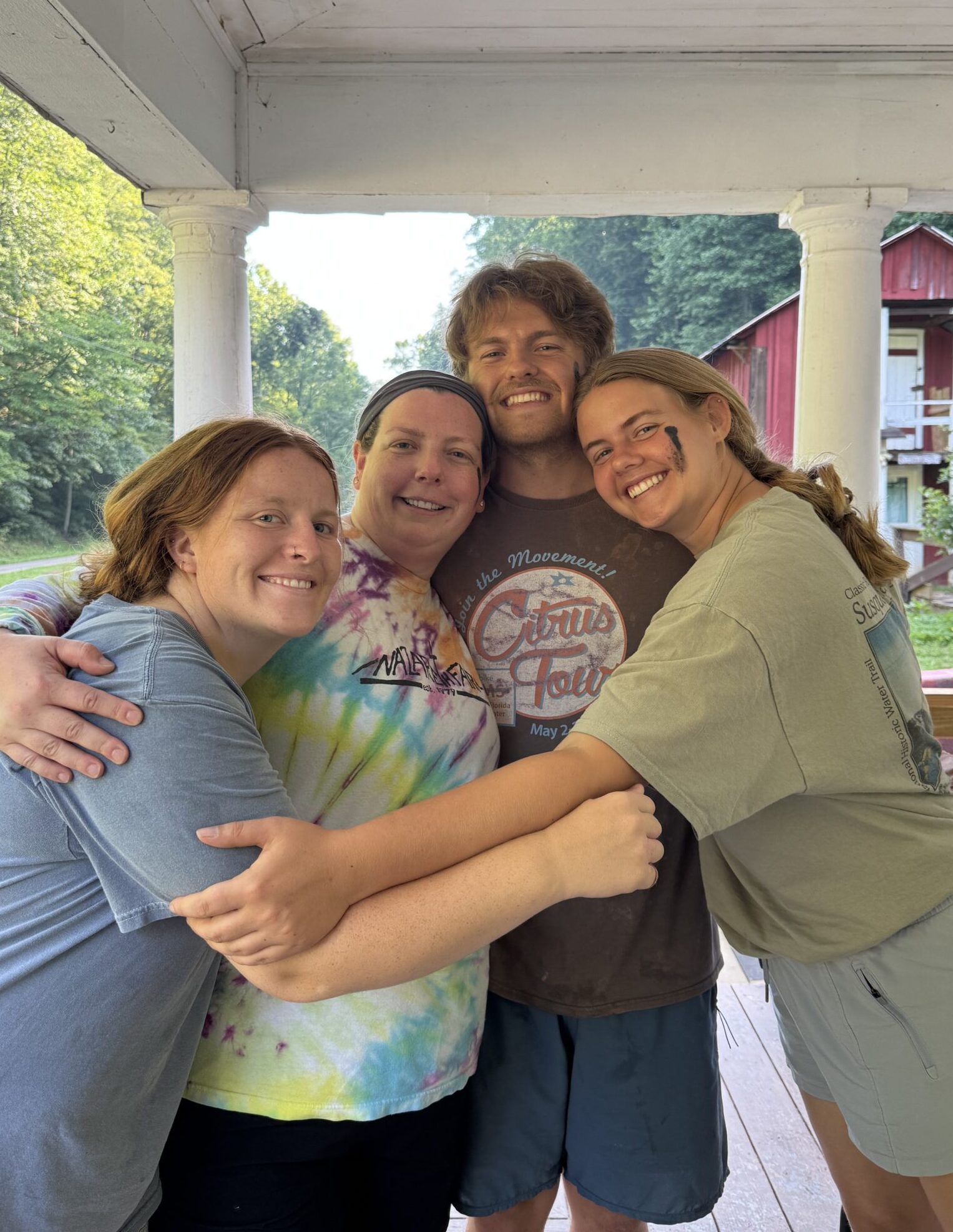 Group of people hugging on the porch